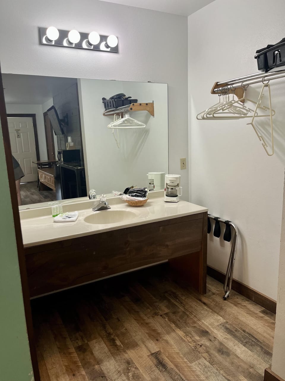 Modern bathroom with spacious vanity and warm wood flooring