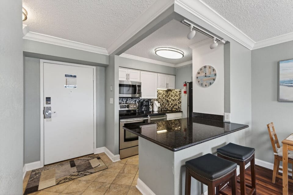 Fully equipped kitchen with bar seating for easy meals.