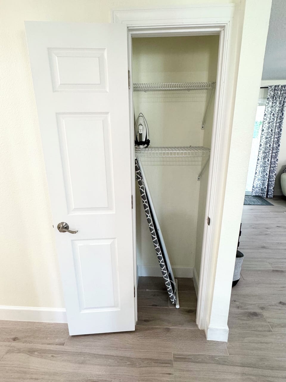 clotset in the hallway -iron board & iron.
