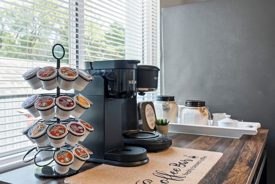 Fully stocked coffee bar with a variety of K-Cups and essentials, this is a warm welcome for every caffeine lover.