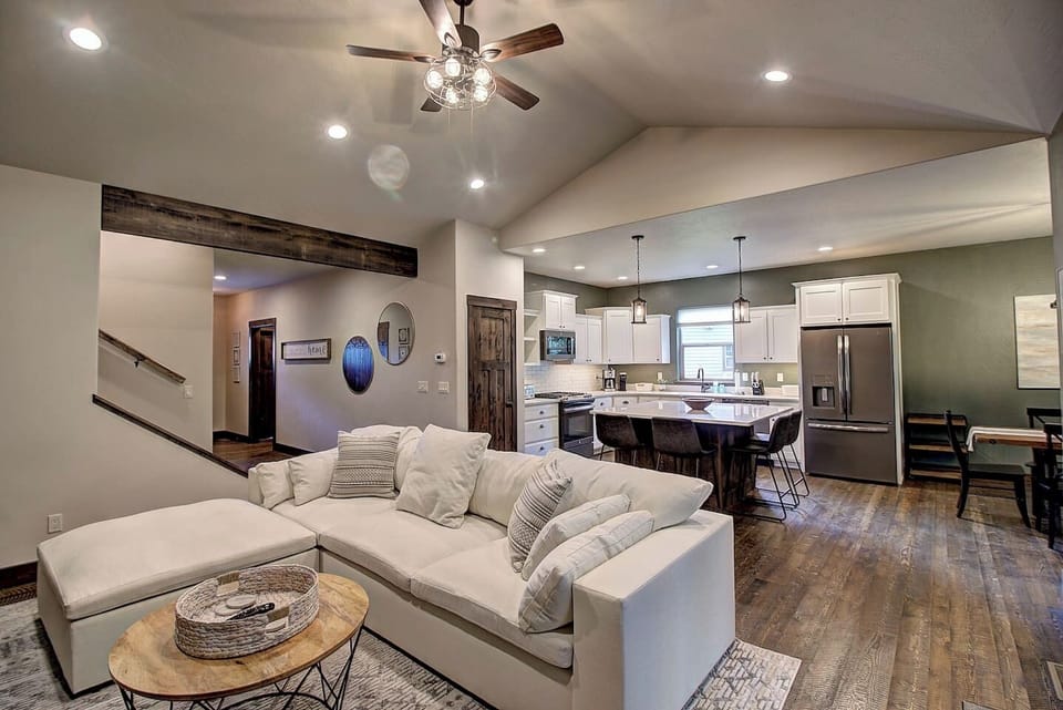 Open-concept layout connecting the living room to the modern kitchen and dining area.