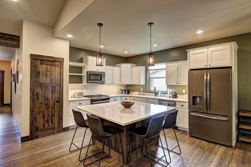 Bright, fully equipped kitchen with modern appliances and ample counter space for easy meal prep.