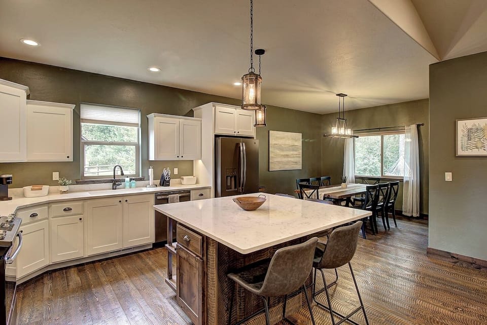Spacious island with seating, perfect for shared breakfasts or gathering while cooking.