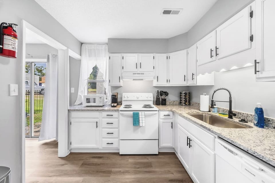 Bright and fully equipped kitchen featuring ample counter space, modern appliances, and everything you need for home-cooked meals.
