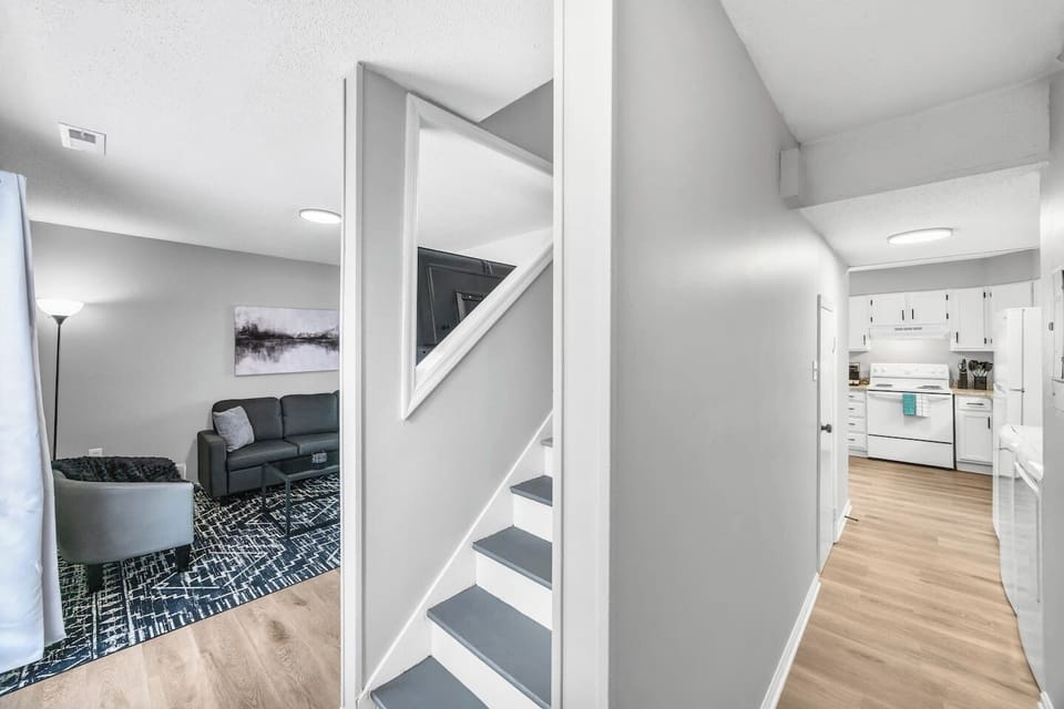 A glimpse of the living room from the hallway, showcasing the home’s clean design and easy flow to the kitchen.