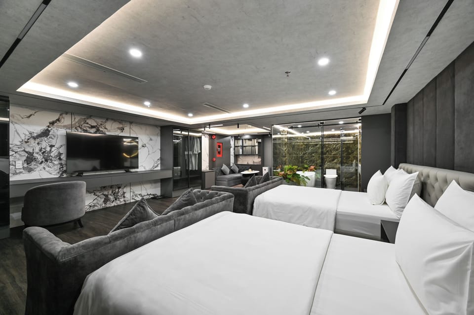 Family Room, Bathtub | Free minibar items, desk, laptop workspace, blackout drapes