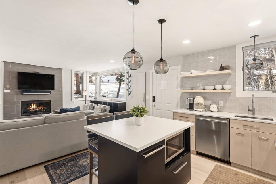 The kitchen island doubles as a dining space and work station for the chef in your group.