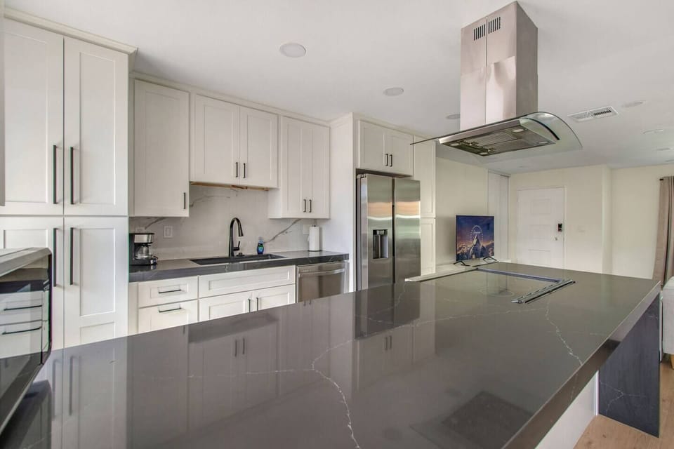 Fully stocked kitchen with stainless steel appliances and all essentials.