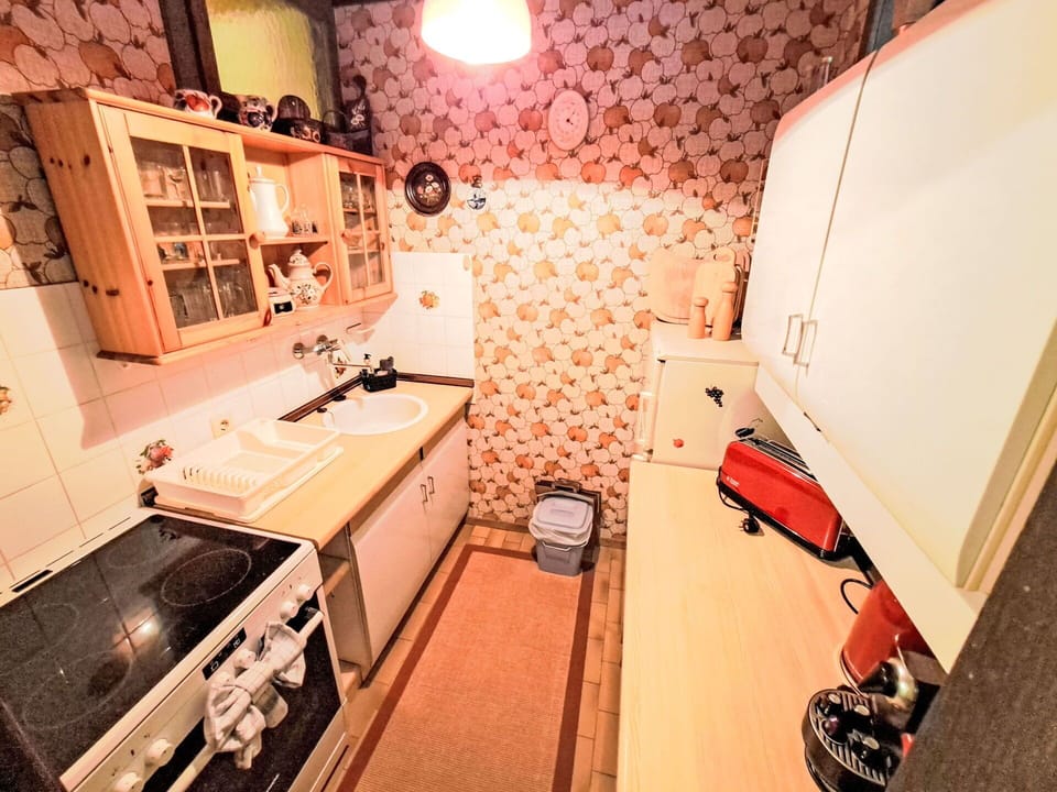 Wood, Interior Design, Flooring, Floor, Furniture, Major Appliance, Room, Lighting, Kitchen, Kitchen Appliance