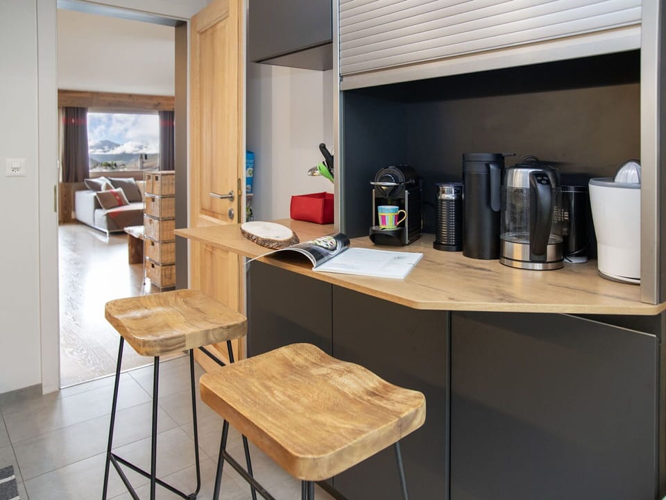 Furniture, Kitchen, Interior Design, Kitchen Appliance, Countertop, Wood, Flooring, Cabinetry, Major Appliance, Lighting