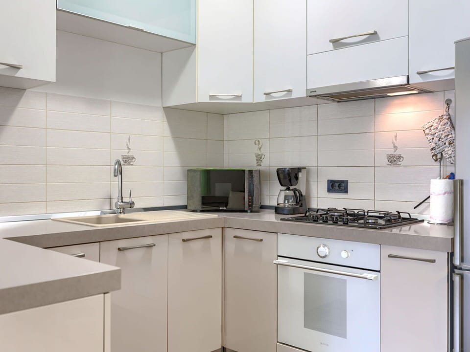 Kitchen Appliance, Kitchen, Countertop, Cabinetry, Major Appliance, Kitchen Stove, Stove, Home Appliance, Kitchen Sink, Interior Design