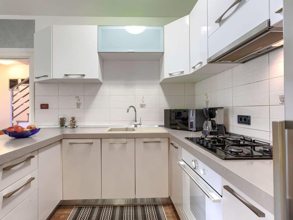 Kitchen Appliance, Kitchen, Countertop, Cabinetry, Major Appliance, Kitchen Stove, Stove, Home Appliance, Kitchen Sink, Interior Design