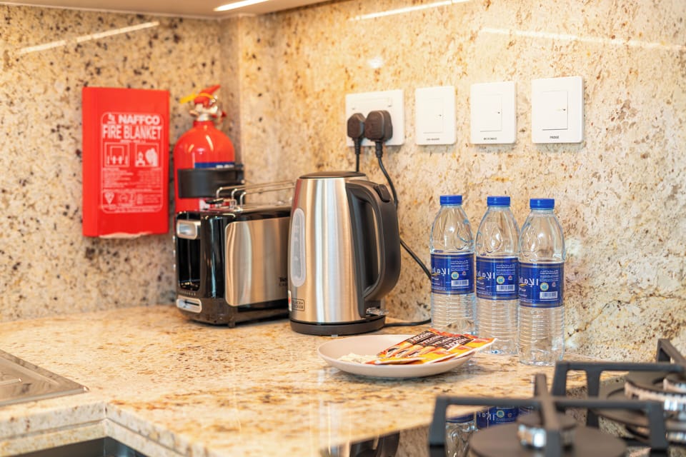 Luxury Apartment, Balcony, City View | Private kitchenette | Full-size fridge, microwave, oven, stovetop