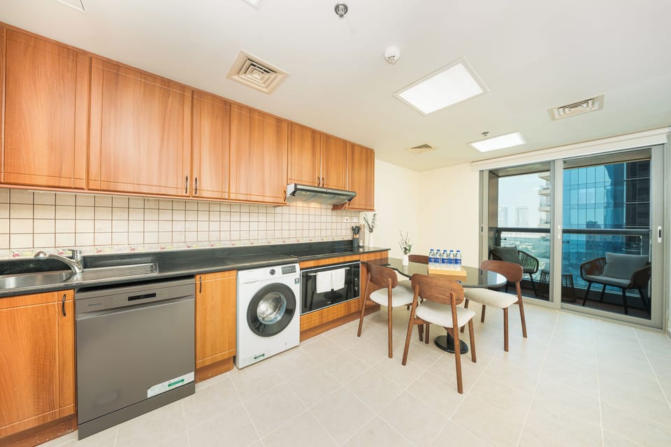 Luxury Apartment, Partial Sea View | Private kitchen | Full-size fridge, microwave, oven, stovetop
