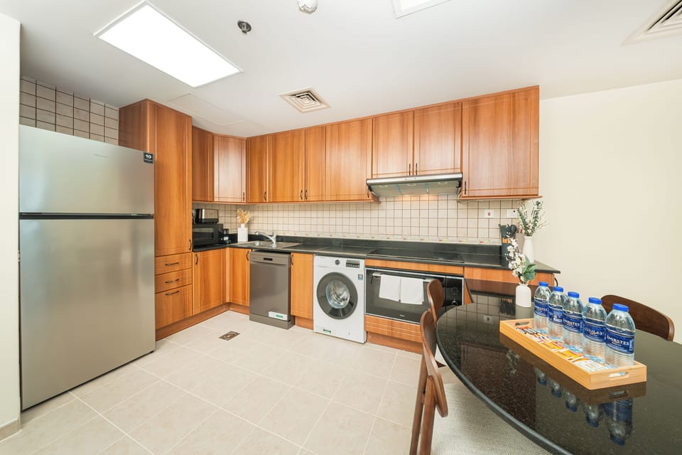 Luxury Apartment, Partial Sea View | Private kitchen | Full-size fridge, microwave, oven, stovetop