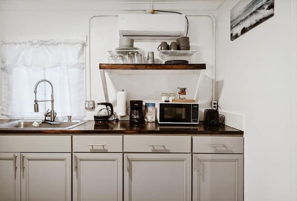 Coffee station setup w/ counter space & shelves for easy mornings