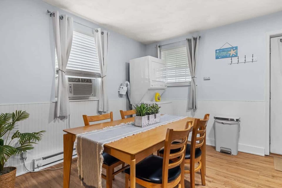 Bright dining space with ample seating and natural light. A cheerful spot for family breakfasts or cozy dinners.