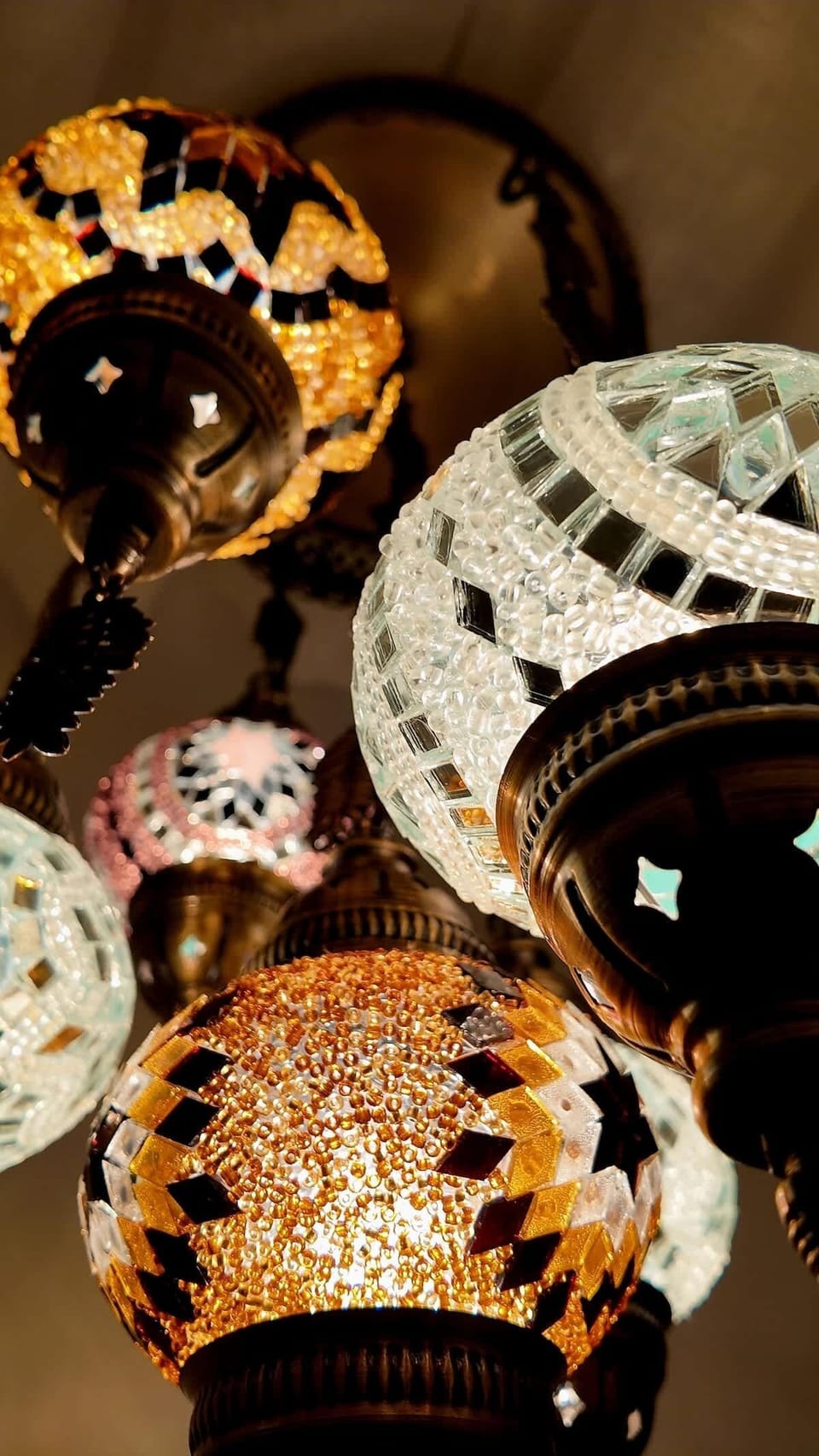 Charming Chandelier: Let the vibrant glow of handcrafted lighting set the mood for your stay!