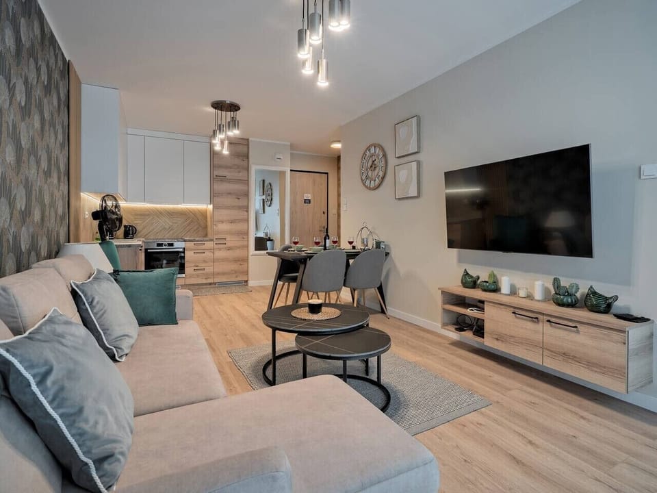 Living Room with Sofa Bed, Smart TV and Dining Table | Book Now with RENTUJEMY.COM