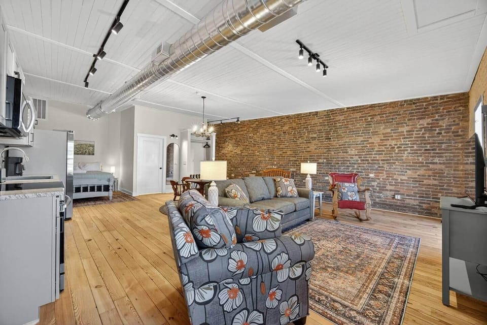 Relax in this cozy living room and watch your favorite show. Enjoy the view as you rock by the window. The 4K Smart TV has all your favorite streaming services pre-downloaded. Bring your own login.
