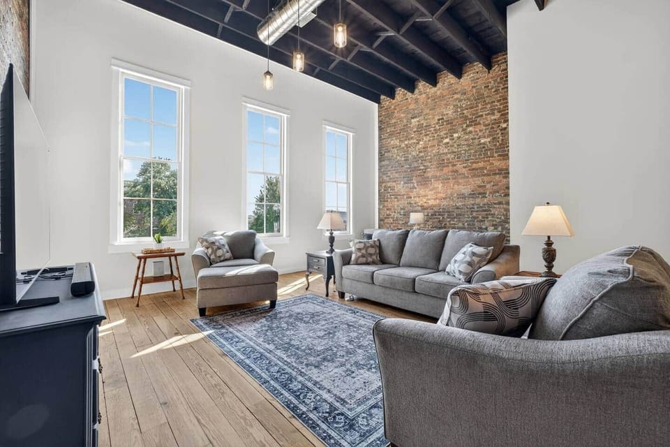 Relax in this spacious living room with a view of the historic downtown square.