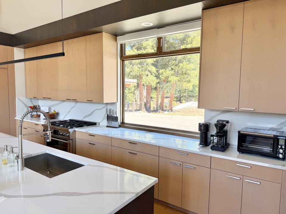 Full kitchen with a sunrise view