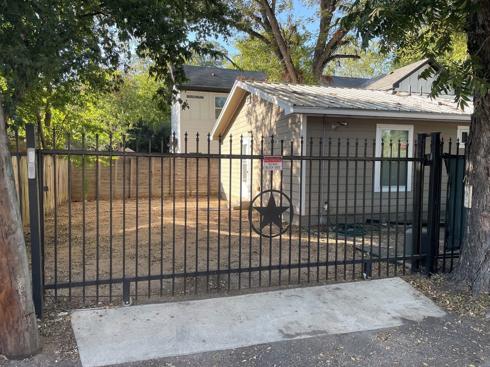 Secure parking for up to 3 cars. Remote control or keypad operated gate entry.