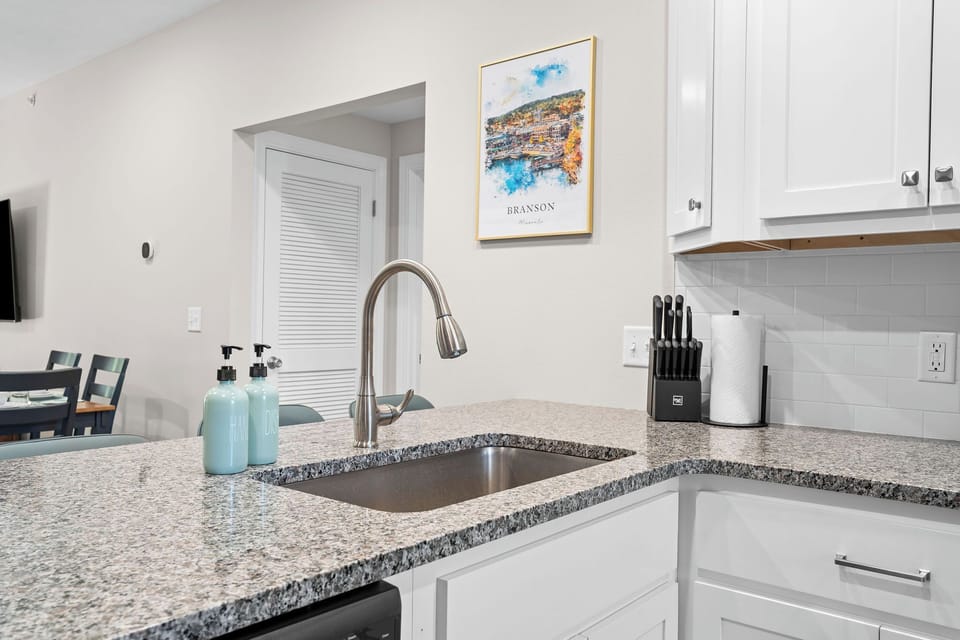 Large kitchen sink looking out towards the living room area.