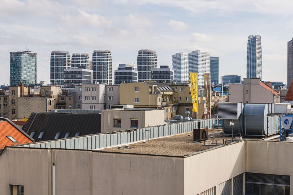 Urban cityscape view from apartment, featuring Bratislava’s modern skyline.