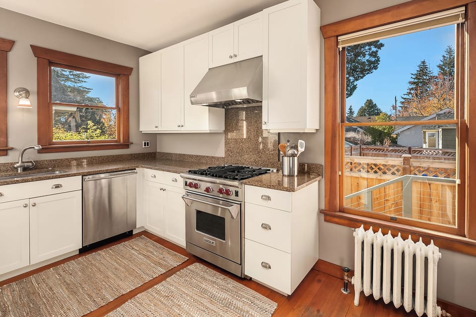 Chef’s kitchen with Wolf range and garden views.