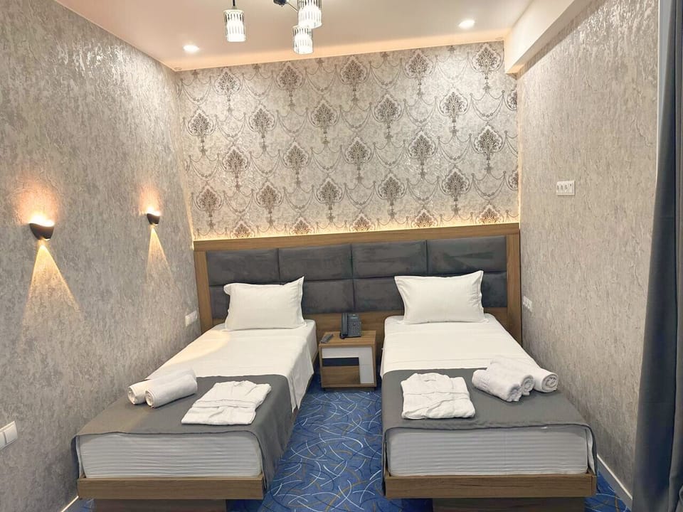 Twin Room, Balcony, City View | Desk, soundproofing, iron/ironing board (on request), WiFi (free)