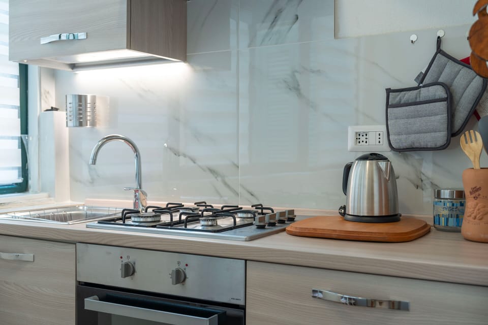 Apartment, 3 Bedrooms, Lake View | Private kitchen | Fridge, oven, stovetop, espresso maker