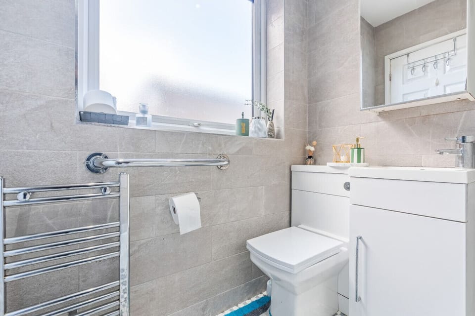 The bathroom has a walk-in shower with complimentary toiletries provided.