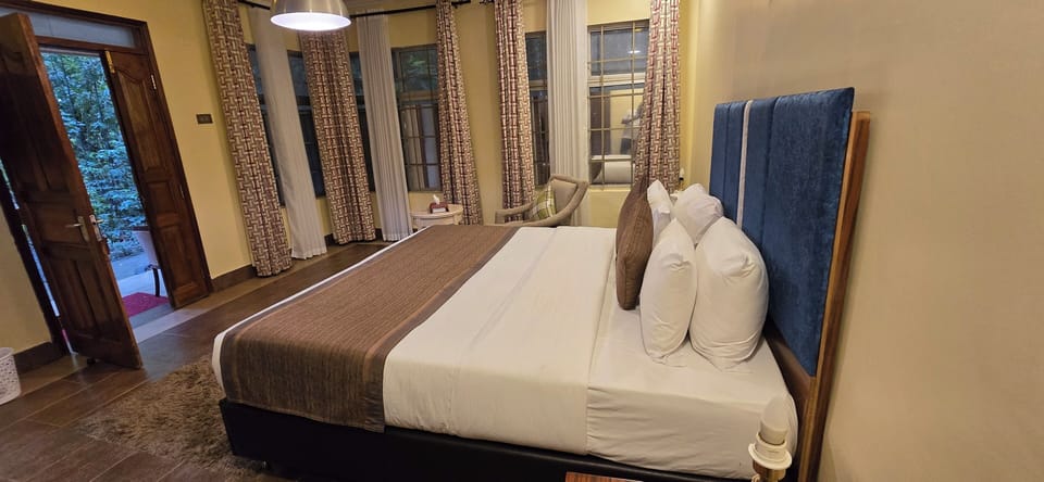 Executive Double Room, Garden View | In-room safe, desk, laptop workspace, soundproofing