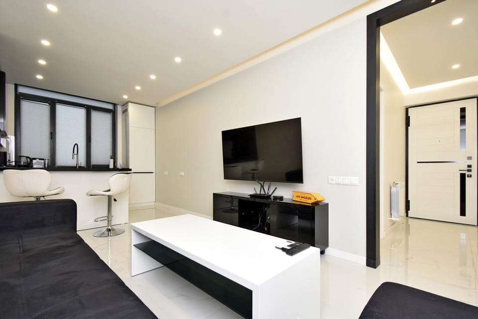 Classic Apartment | Living area | 50-inch flat-screen TV with cable channels