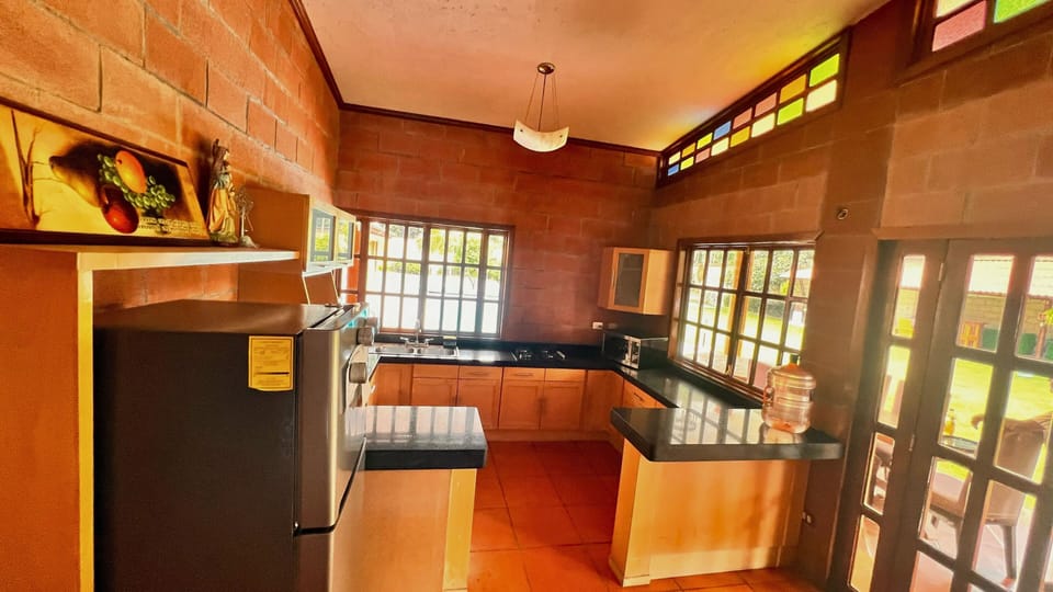 Family Townhome, Pool View | Private kitchen