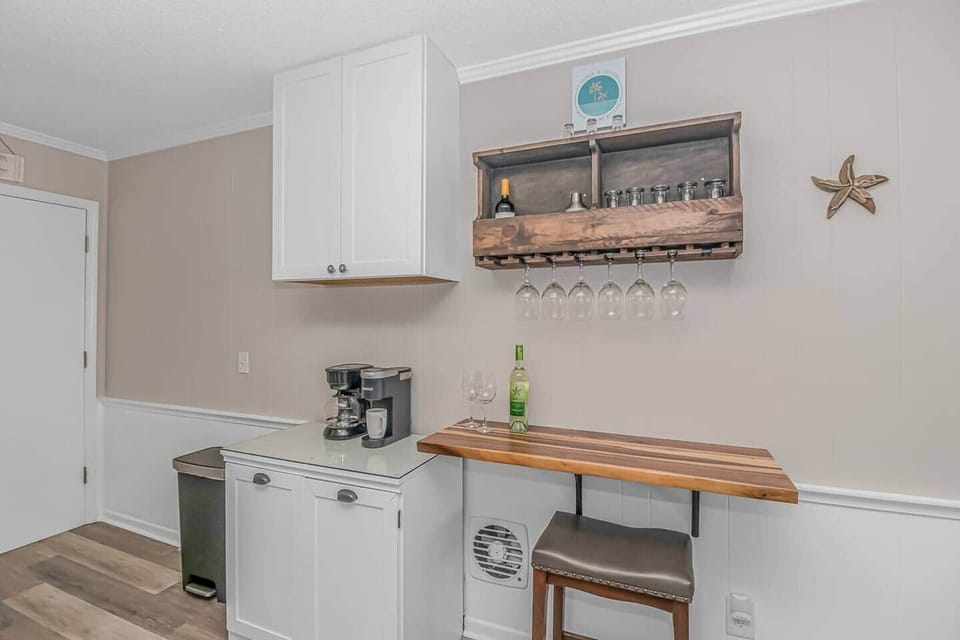 Cute coffee/wine station with Keurig and Automatic coffee maker, plenty of storage and seating!