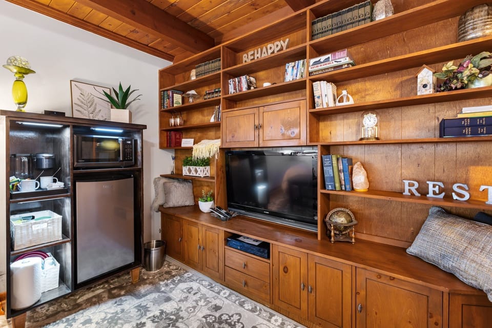 Coffee cart, library, and entertainment center.