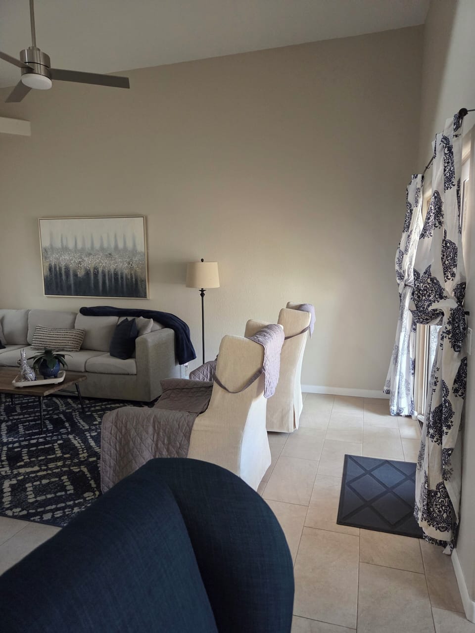 Living room with arcadia door that leads outside to the backyard