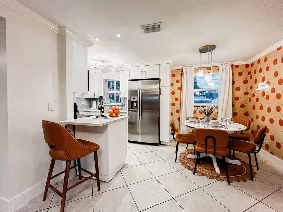 Kitchen with Refrigerator, Dishwasher, Oven, Microwave, Mini Bar, Utensils, Pots & Pans & Cookware. Dining Room with Comfortable Seating.