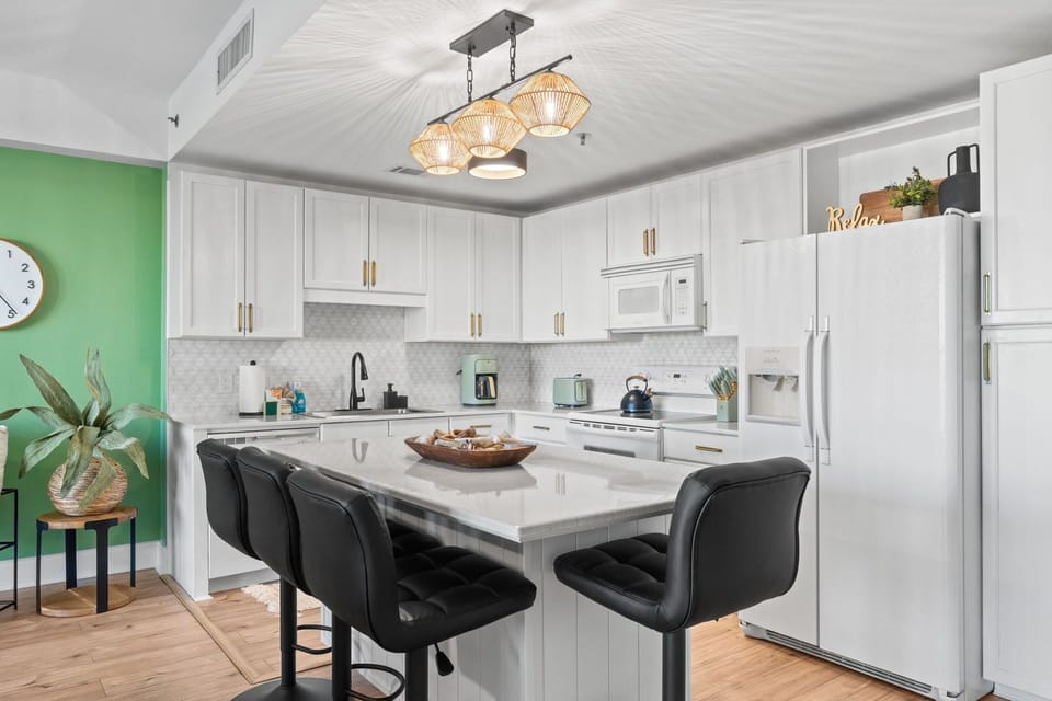 The kitchen is both functional and inviting, thoughtfully equipped with all the essentials for a comfortable stay—from cookware and utensils to small appliances that make meal prep a breeze.