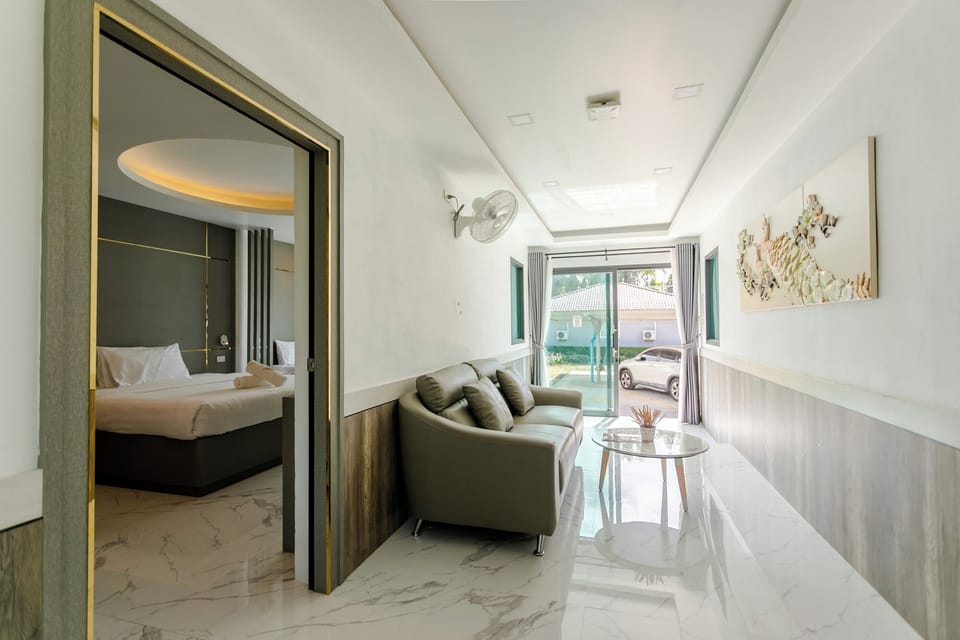 Deluxe Villa | Living area | 42-inch LED TV with cable channels