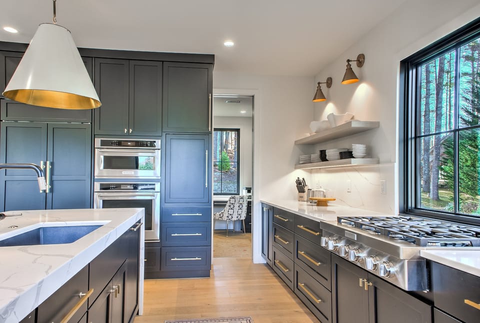Kitchen is outfitted with a Gas Cooktop & Double Ovens