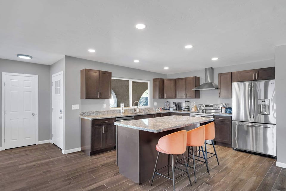 Enjoy meals in this bright dining area featuring a sleek table, comfortable seating, and modern décor. Perfect for sharing breakfast, planning your day, or enjoying a cozy dinner in.