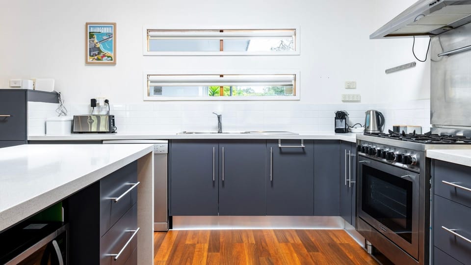 Modern kitchen with sleek finishes and appliances.