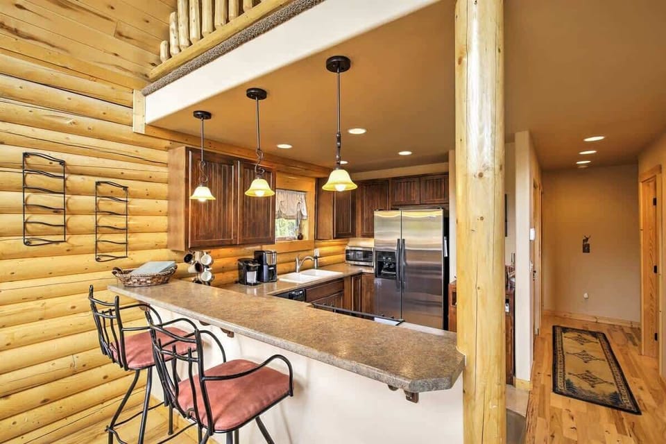 Rustic kitchen with a breakfast bar and pendant lighting