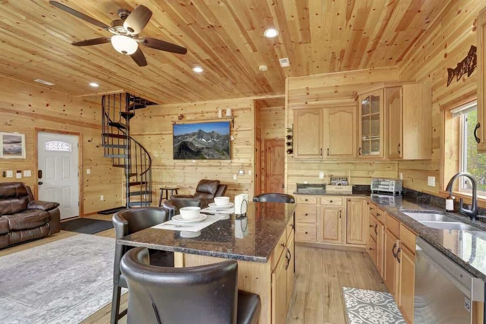Open kitchen and living space with natural light and scenic views