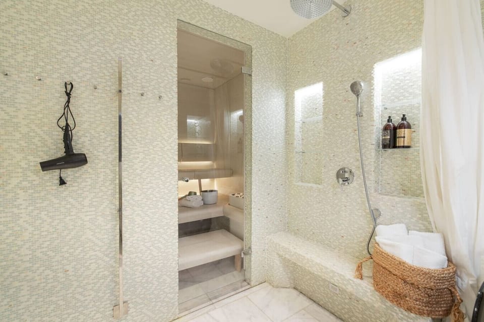 Modern bathroom with clean lines, high-end fixtures, and a bright, inviting design — your private oasis in the city.