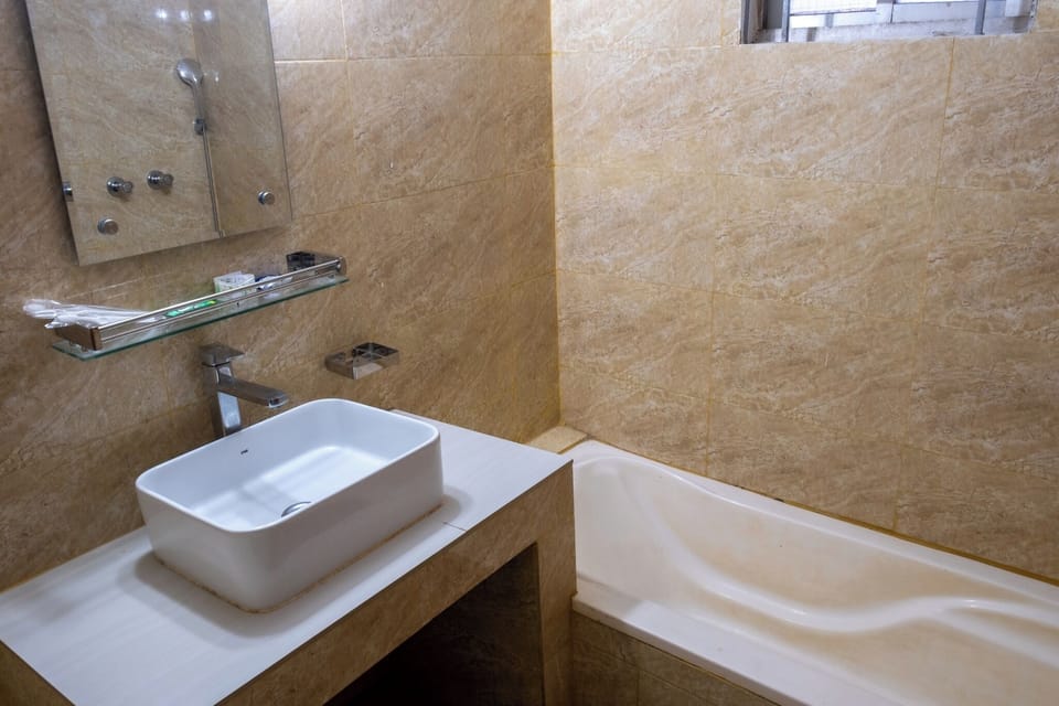 Deluxe Double Room, Beach View | Bathroom | Free toiletries, slippers, towels, soap