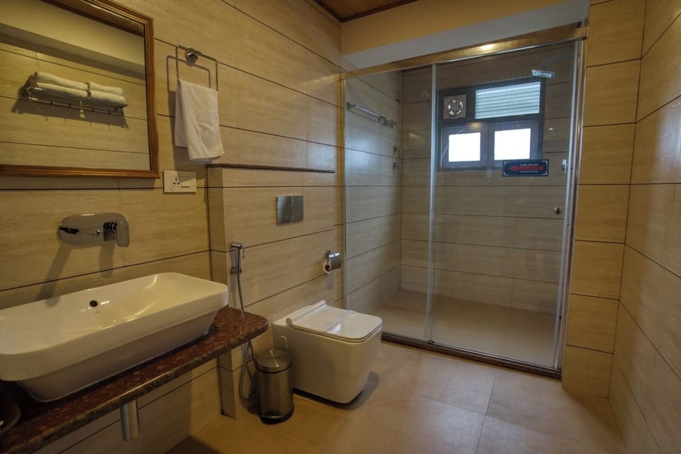 Shower, free toiletries, slippers, soap